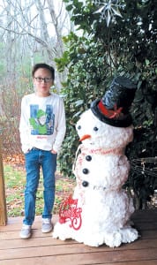 Wyatt Heath, 12, and his mom Chastidy created this dapper snowman from spray foam, a water-sealant adhesive, and a trash can from The Dollar Tree. (Photo by Angela H. Hill)